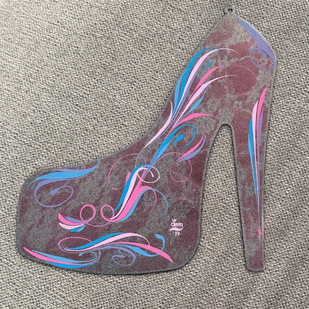 Metal pinstripe high heel art piece